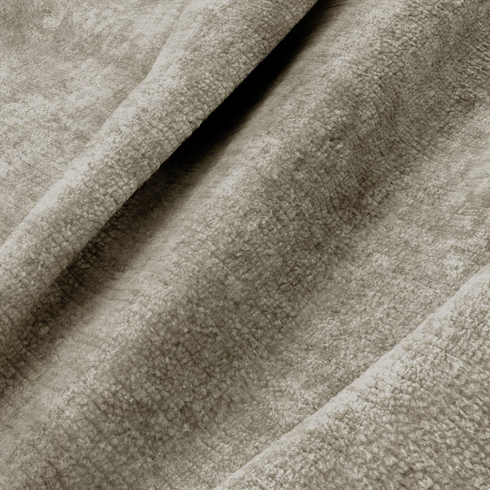 180° draaibare loungestoel in taupekleurig fluweel met textuur.