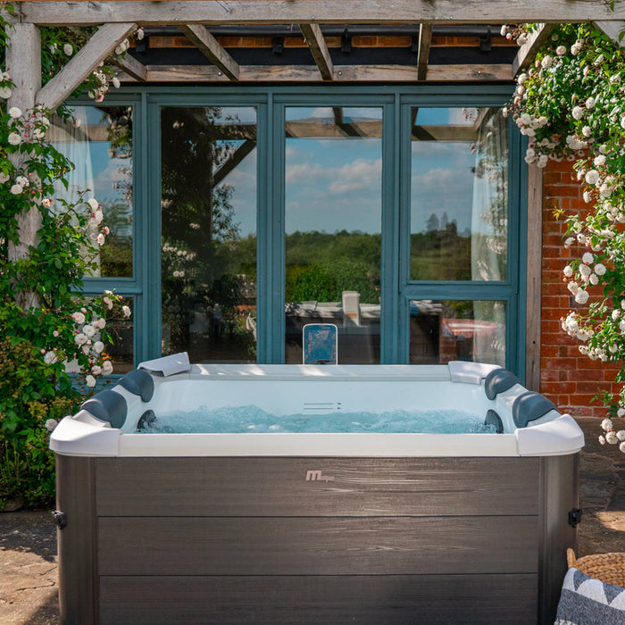 sweeek - 6-persoons vaste spa 180cm grijs hydromassages 4 kussens 8