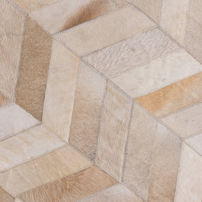 PTMD Joanne Beige cowhair patchwork carpet round L