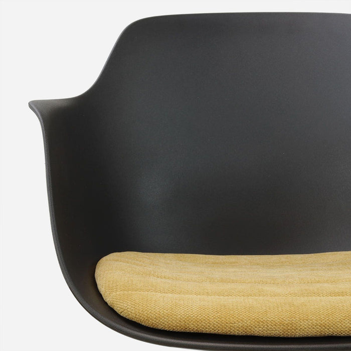 Nolon Nola-Liz draaibare eetkamerstoel zwart met warm oker zitkussen -