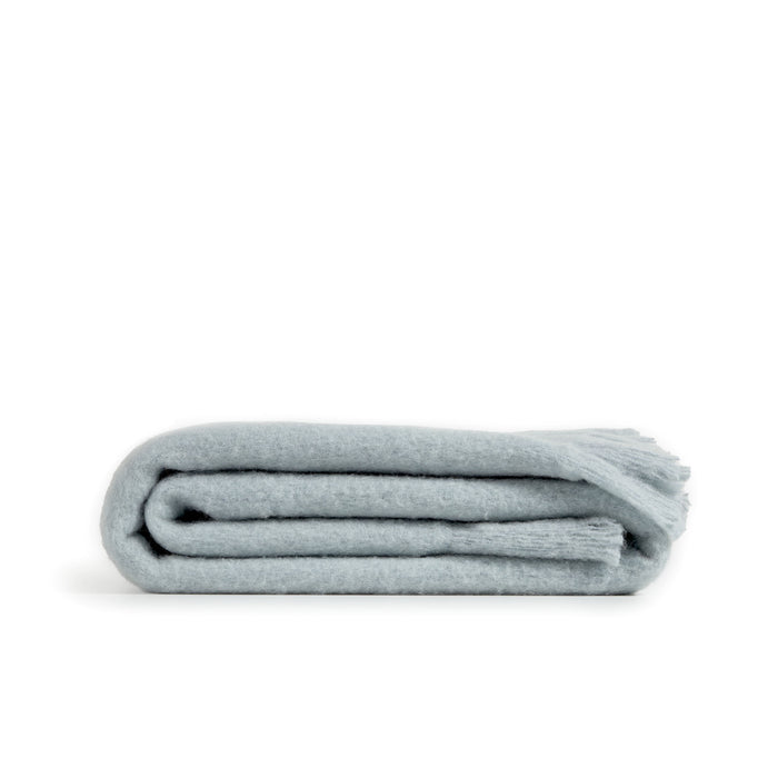 Kave Home - Haru deken met golvende rand in blauw wol, 125 x 150 cm